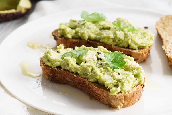 Healthy breakfast toast with avocado smash