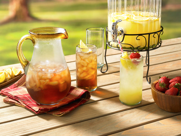 Summer drinks including iced tea and lemonade in batches and individual glasses.