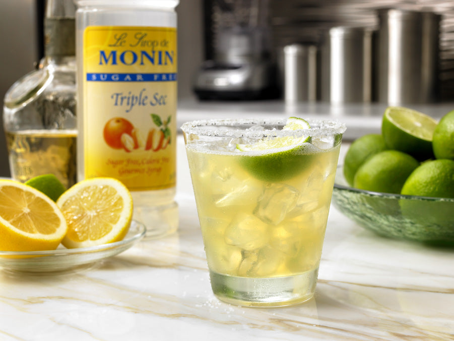 Margarita in a salted rim and a lime wedge using Monin Triple Sec