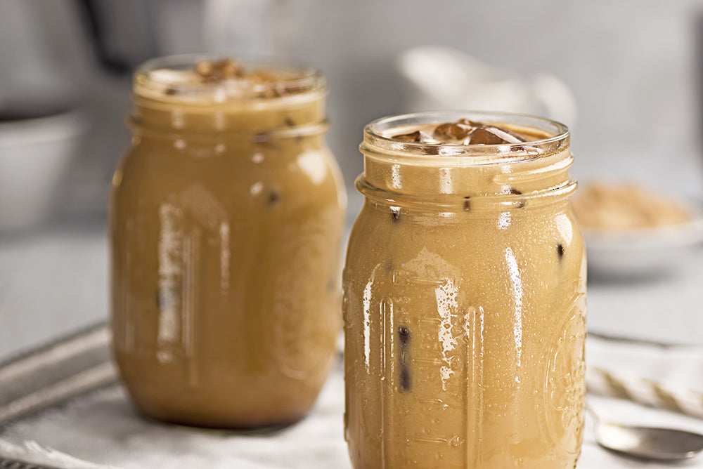 Two Glass Jars of Cold Iced Coffee with Cream