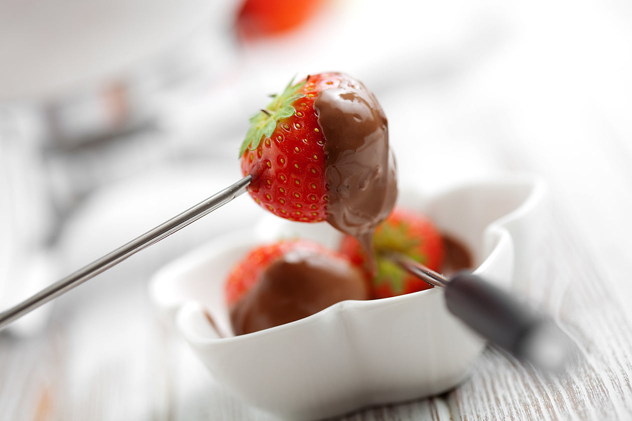 Chocolate hazelnut fondue with fresh strawberries, selective focus