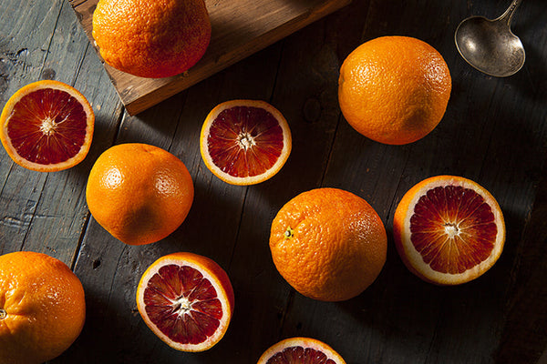 Organic Raw Red Blood Oranges on a Background